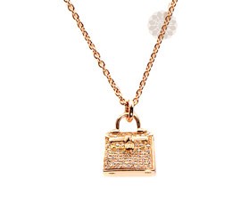 Vogue Crafts and Designs Pvt. Ltd. manufactures Diamond and Gold Purse Pendant at wholesale price.